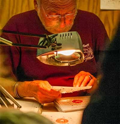 Contestents watching man judge targets